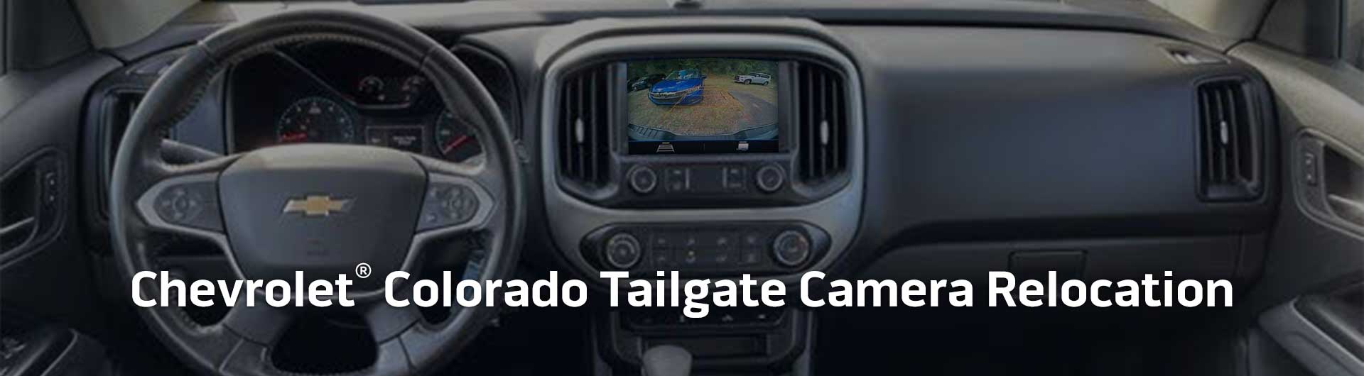 An image showing the dashboard monitor of a Chevrolet Colorado with the view from the backup camera on display.