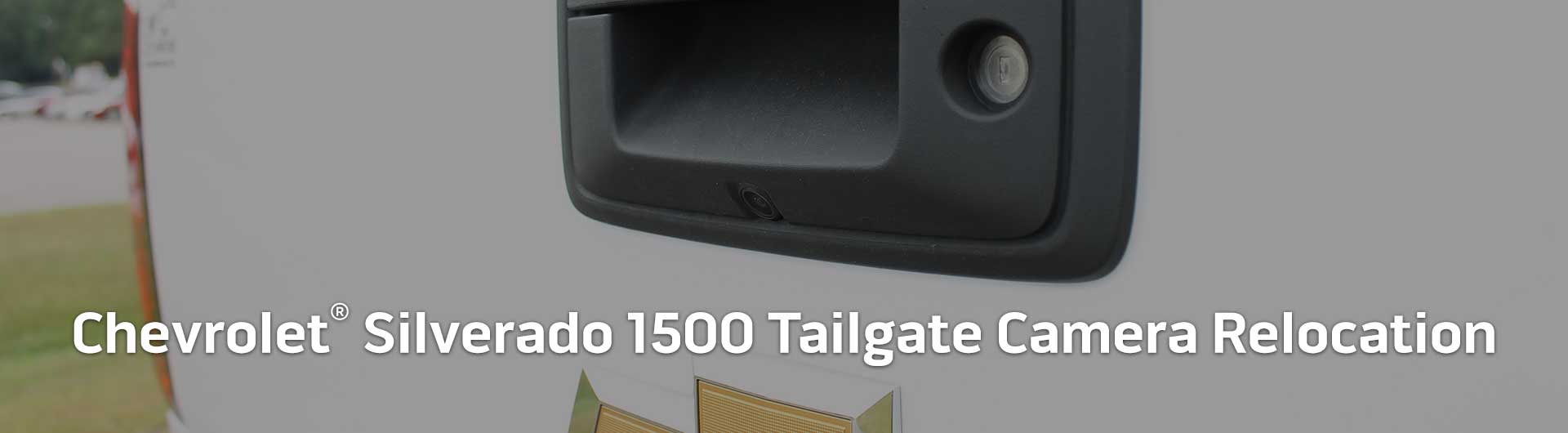 An image showing the tailgate of a Chevrolet Silverado 1500 with a backup camera built into the tailgate handle.