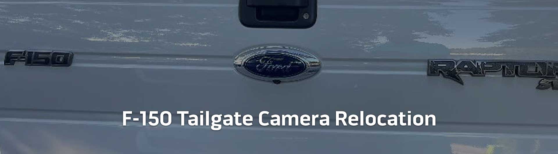 An image showing the in-dash monitor of a Ford truck. The in-dash monitor shows that the truck is in reverse and is displaying both the backup camera and video from the cameras on the front and side of the truck. The image has text that reads Ford Trucks Tailgate Camera Relocation.