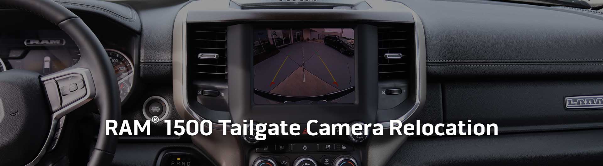 An image showing the dashboard monitor of a RAM 1500 with the view from the backup camera on display.