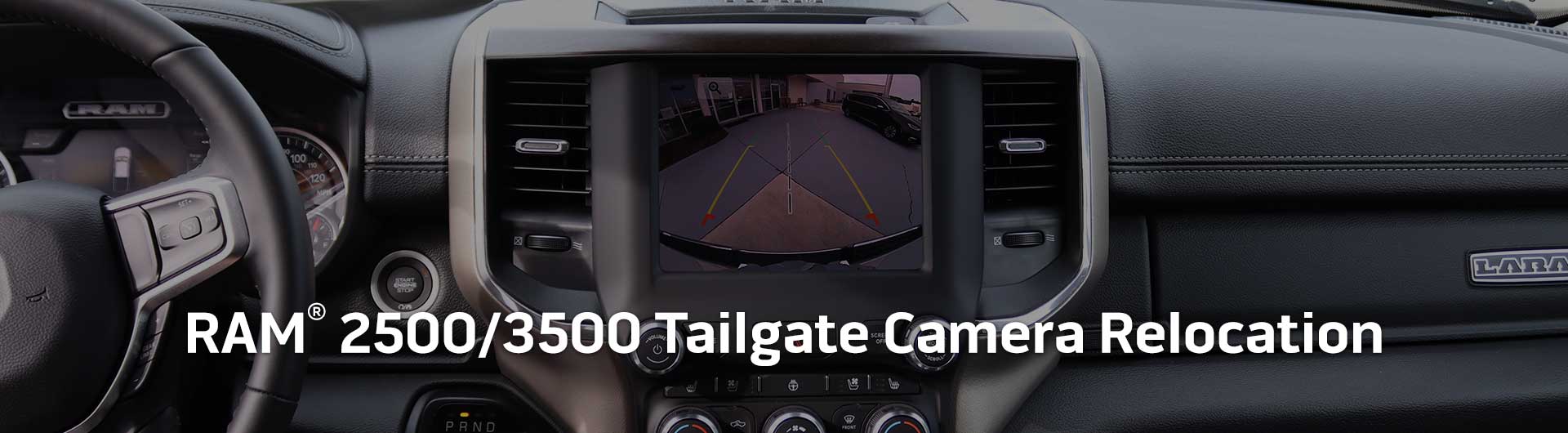 An image showing the dashboard monitor of a RAM 2500-3500 with the view from the backup camera on display.