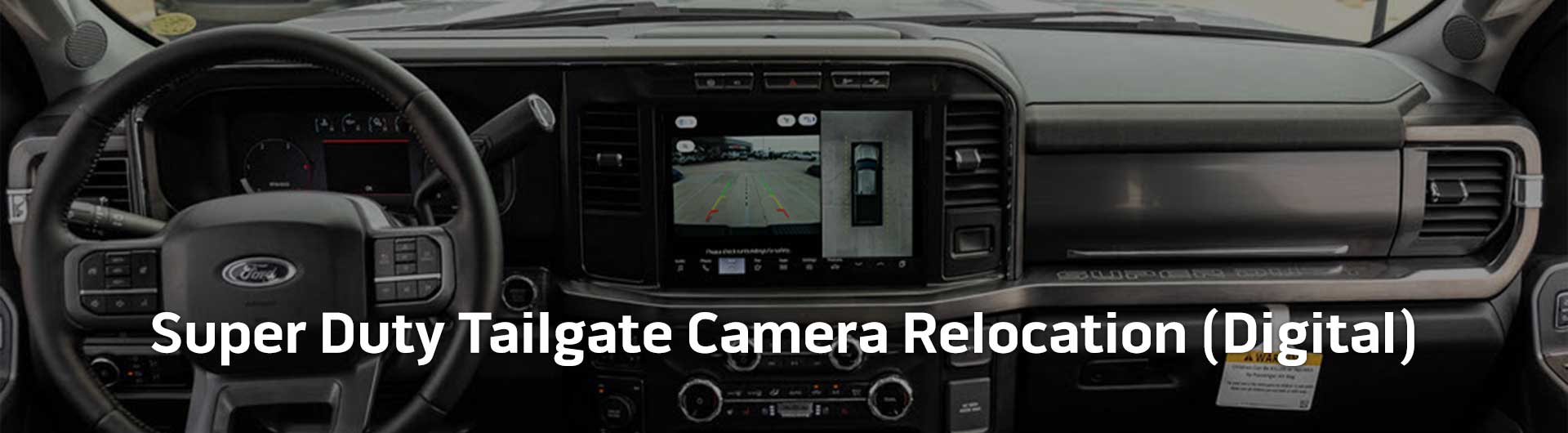 An image showing the dashboard of a Ford Super Duty truck with an around-view camera system activated. Text overlaid onto the image reads Super Duty Tailgate Camera Relocation (Digital)