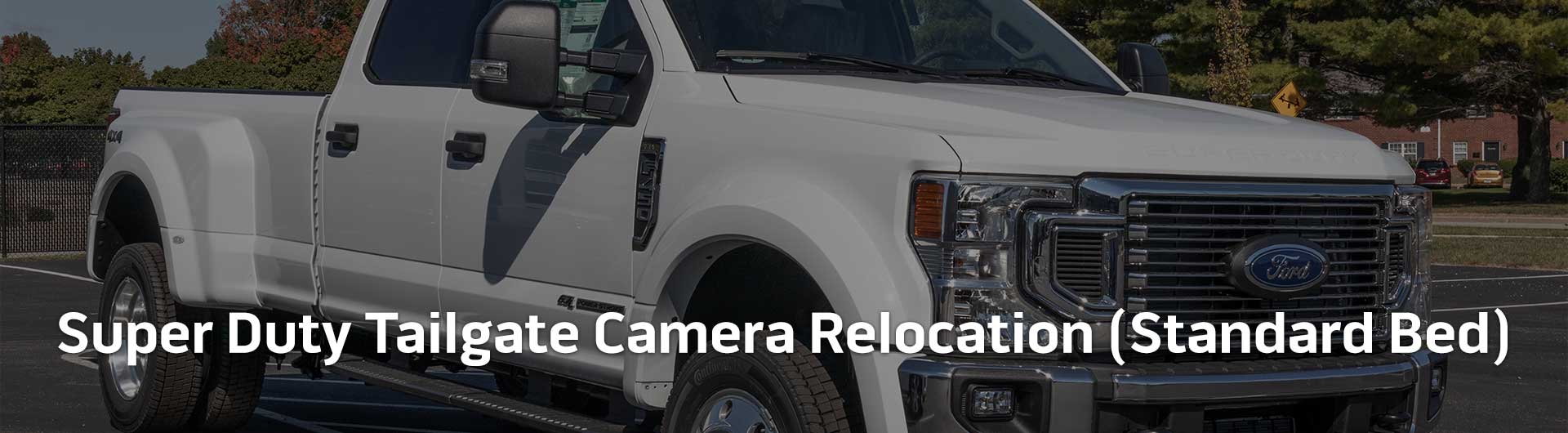 An image showing the in-dash monitor of a Ford truck. On the screen is an image from the backup camera.